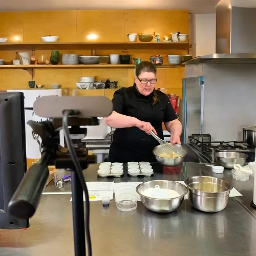 Chef Teey teaching a live online cooking class for families
